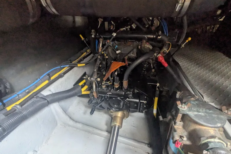 Slide: The Image of Engine compartment of a 2006 Meridian 341 Sedan boat, showcasing mechanical components and wiring. - 37