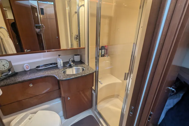 Slide: The Image of Luxurious bathroom in a 2006 Meridian 341 Sedan yacht with modern amenities. - 34