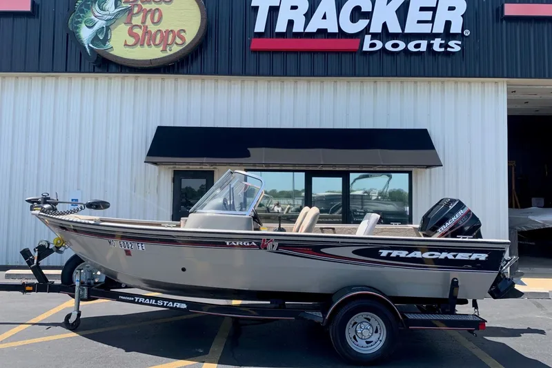 The Image of 2005 Tracker Targa 17 WT boat on trailer outside Bass Pro Shops. - 1