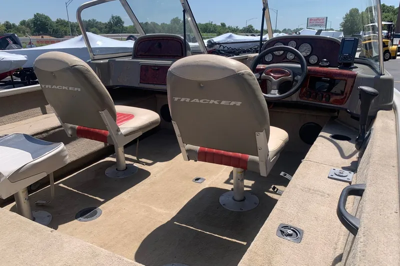 Slide: The Image of 2005 Tracker Targa 17 WT boat interior with steering wheel and seating. - 11