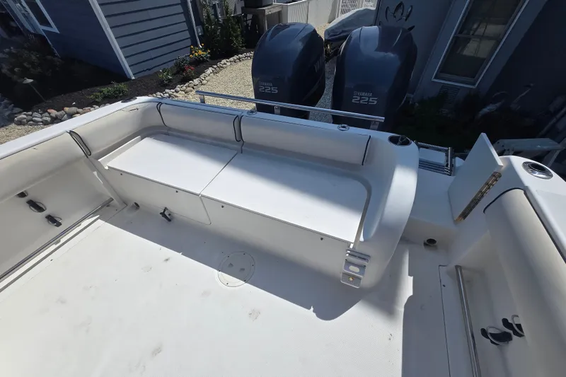 Slide: The Image of 2006 Robalo R265 Walkaround boat deck with Yamaha 225 engines, featuring spacious seating. - 30