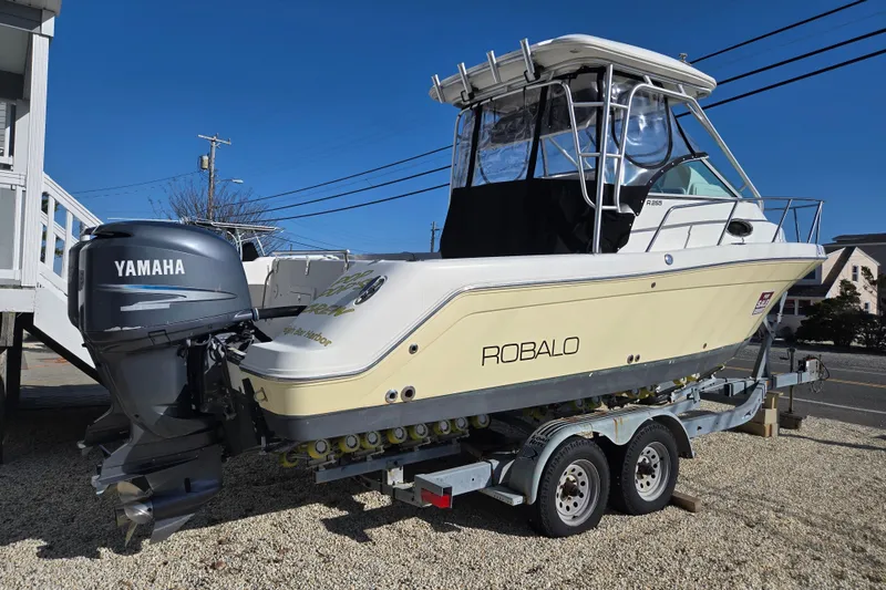 The Image of 2006 Robalo R265 Walkaround boat on trailer with Yamaha outboard motor. - 0