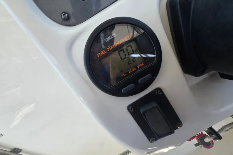 Slide: The Image of Yamaha fuel management gauge on 2006 Robalo R265 Walkaround boat dashboard. - 16