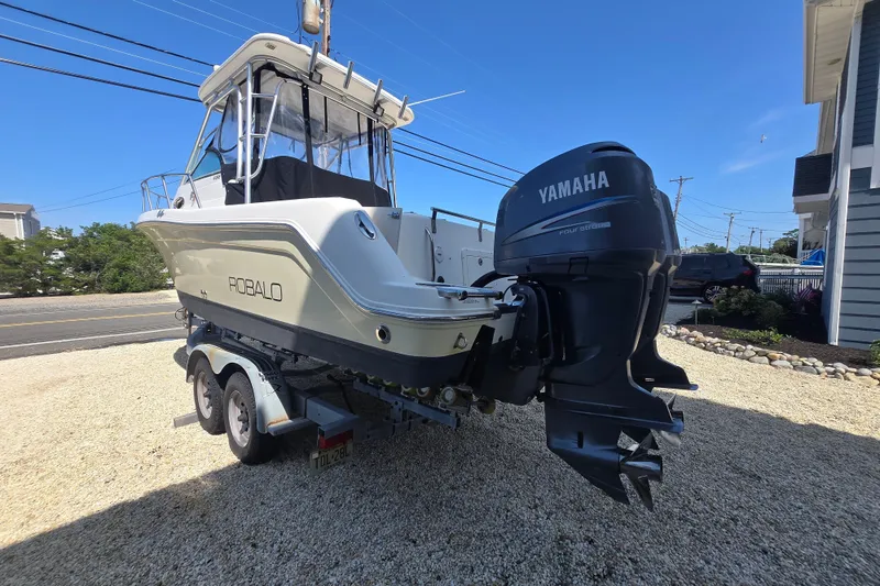 Slide: The Image of 2006 Robalo R265 Walkaround boat with Yamaha outboard motor on a trailer. - 3