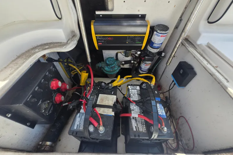 Slide: The Image of Electrical system of a 2006 Robalo R265 Walkaround boat, featuring batteries and wiring. - 29