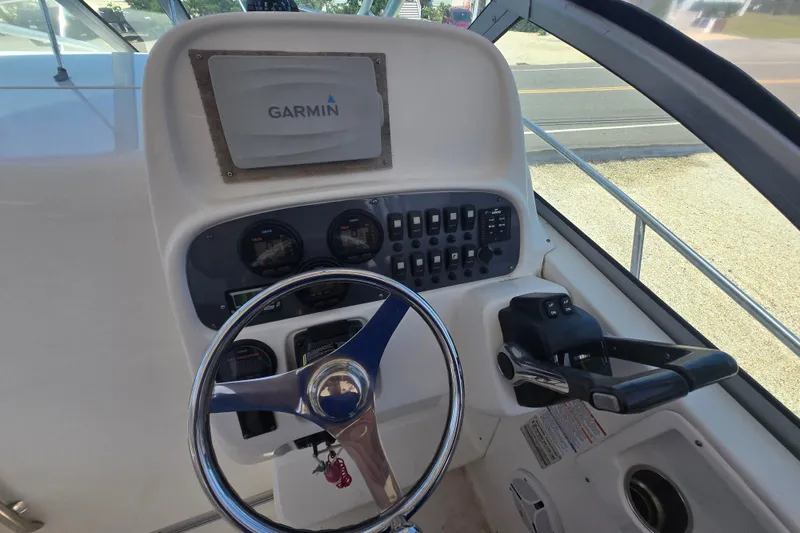 Slide: The Image of 2006 Robalo R265 Walkaround helm with Garmin navigation system and control panel. - 15