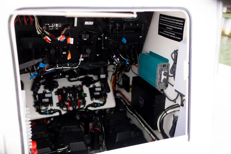 Slide: The Image of Interior view of 2021 Onslow Bay 27 Offshore Edition boat's electrical system and wiring. - 26
