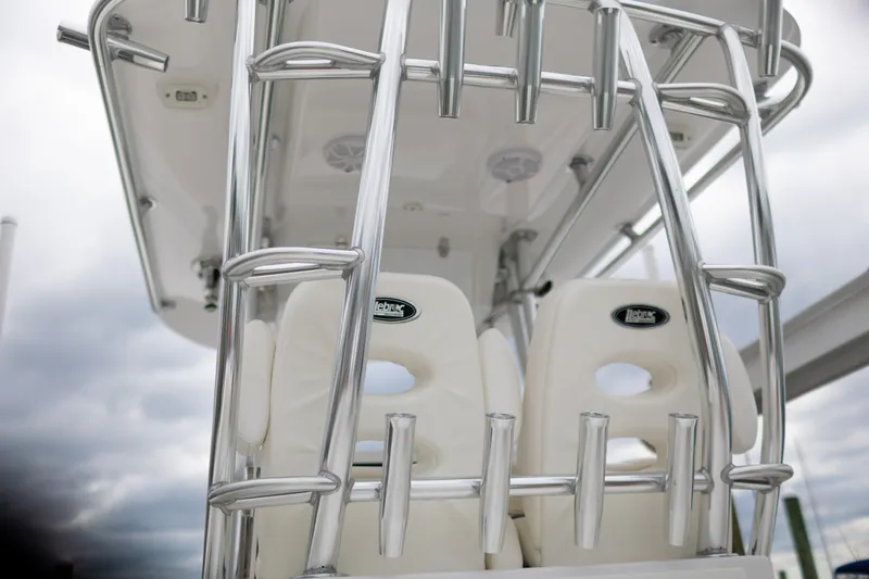 Slide: The Image of 2021 Onslow Bay 27 Offshore Edition boat with sleek metal framework and white seating. - 16