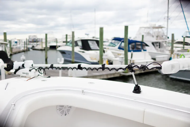 Slide: The Image of 2021 Onslow Bay 27 Offshore Edition boat docked with trolling motor. - 19