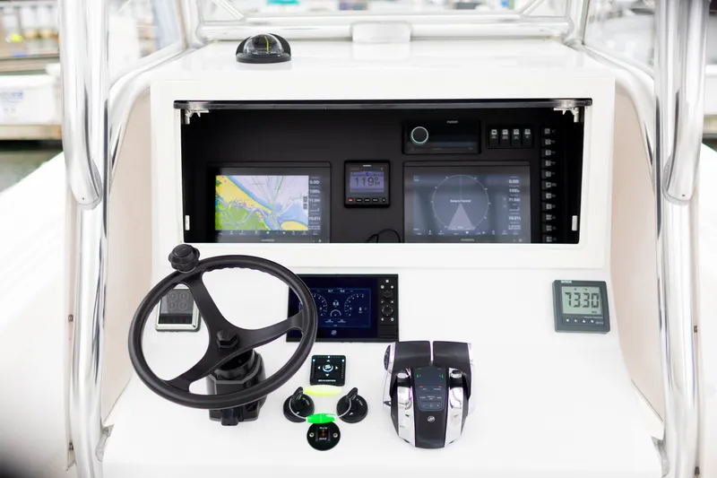 Slide: The Image of 2021 Onslow Bay 27 Offshore Edition boat dashboard with navigation and control systems. - 4