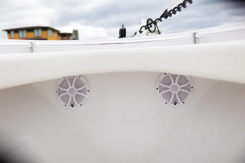 Slide: The Image of 2021 Onslow Bay 27 Offshore Edition boat speakers, white interior, cloudy sky background. - 20