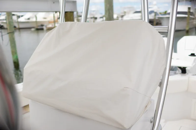 Slide: The Image of 2021 Onslow Bay 27 Offshore Edition boat console covered at marina. - 27