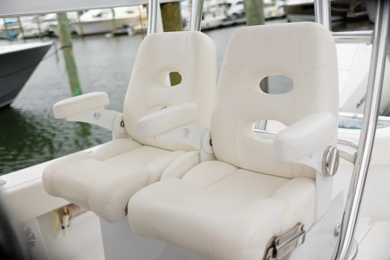 Slide: The Image of Luxury white seats on 2021 Onslow Bay 27 Offshore Edition boat. - 10
