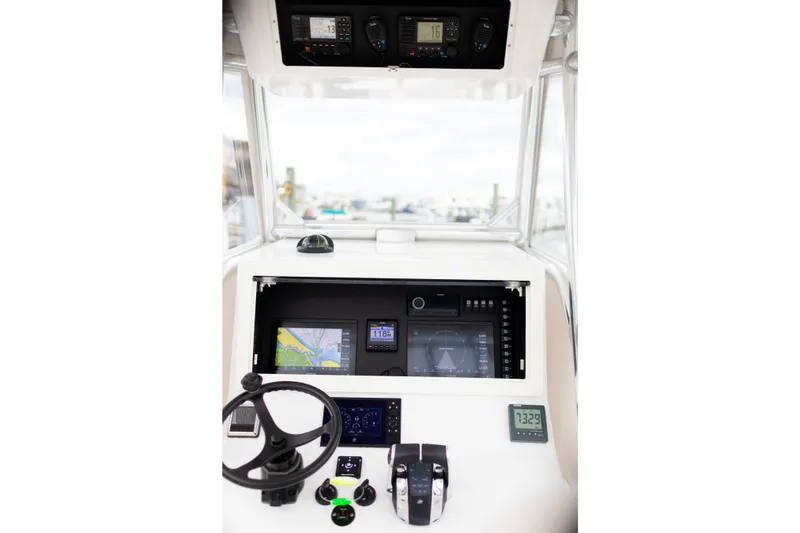 Slide: The Image of 2021 Onslow Bay 27 Offshore Edition boat dashboard with navigation and control systems. - 6