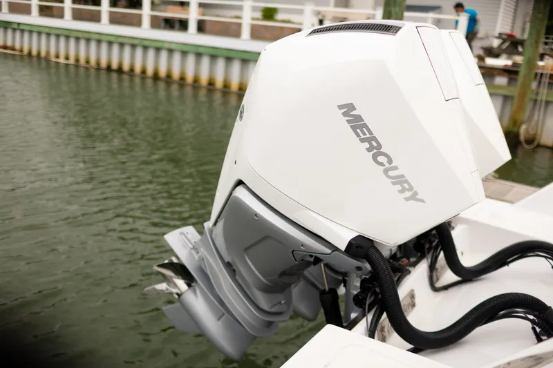 Slide: The Image of 2021 Onslow Bay 27 Offshore Edition with Mercury outboard engine by the dock. - 18