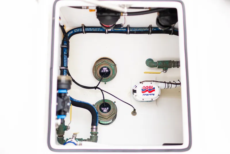 Slide: The Image of 2021 Onslow Bay 27 Offshore Edition bilge area with Rule-Mate 1500 pump and hoses. - 9