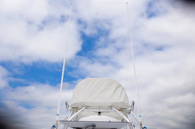 Slide: The Image of 2021 Onslow Bay 27 Offshore Edition boat against a cloudy sky. - 31