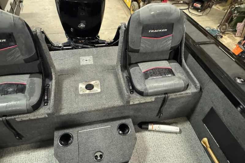 Slide: The Image of 2023 Tracker Targa V-18 WT boat interior with dual seats and motor view. - 12