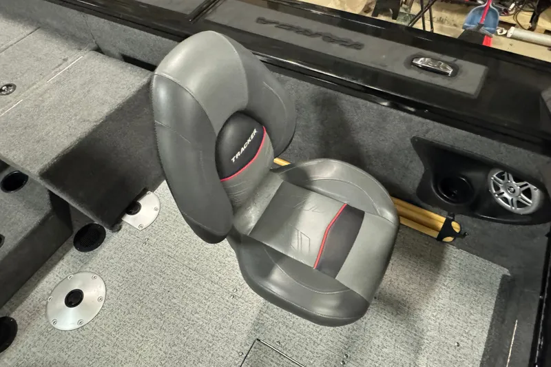 Slide: The Image of 2023 Tracker Targa V-18 WT boat interior with gray seating and speaker system. - 7