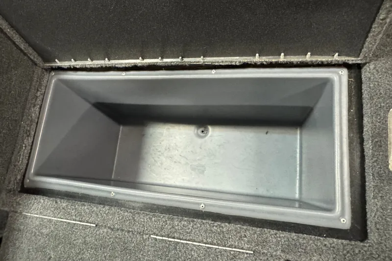 Slide: The Image of Storage compartment in 2023 Tracker Targa V-18 WT boat, featuring durable interior design. - 10