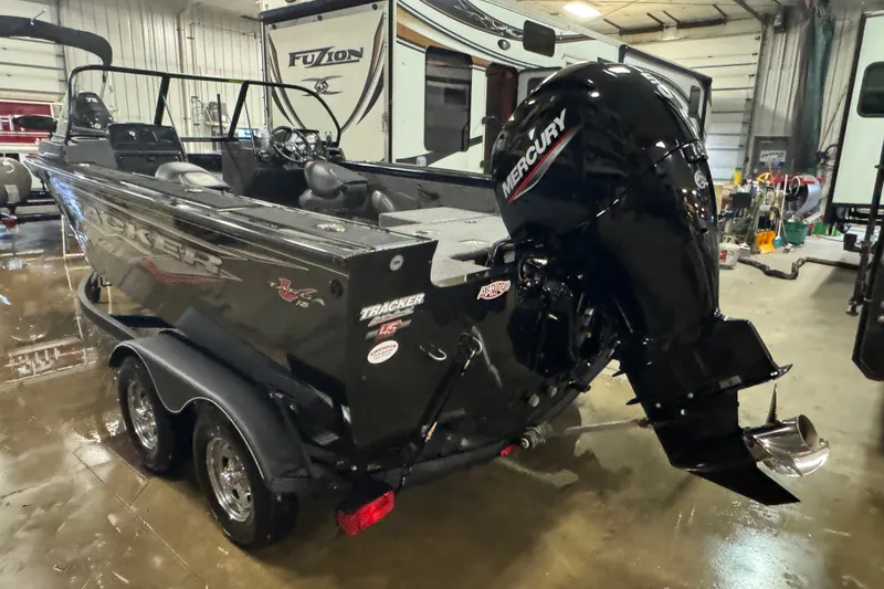Slide: The Image of 2023 Tracker Targa V-18 WT boat with Mercury engine in indoor storage. - 4