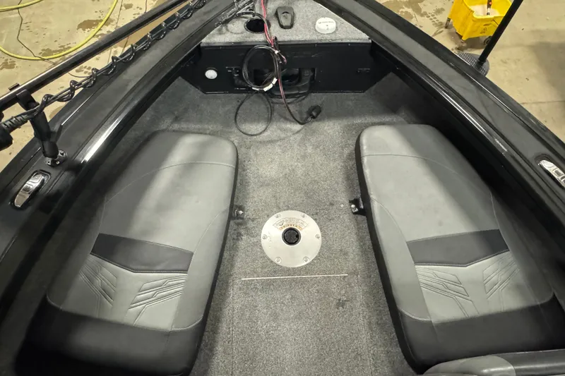 Slide: The Image of Interior of 2023 Tracker Targa V-18 WT boat with gray seating and carpeted floor. - 14