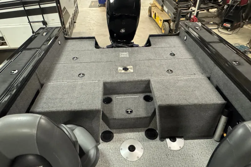 Slide: The Image of 2023 Tracker Targa V-18 WT boat interior with gray carpet and seating. - 8