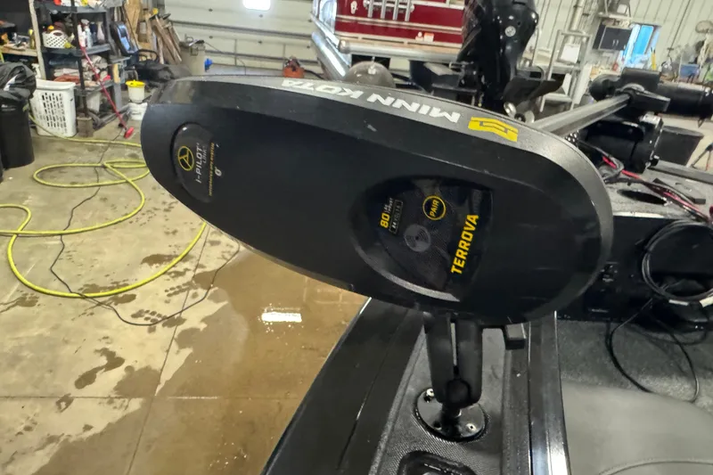 Slide: The Image of Minn Kota Terrova motor on 2023 Tracker Targa V-18 WT in a garage setting. - 16