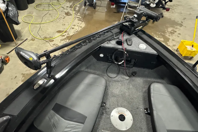 Slide: The Image of 2023 Tracker Targa V-18 WT boat interior with Minn Kota trolling motor and gray seating. - 15