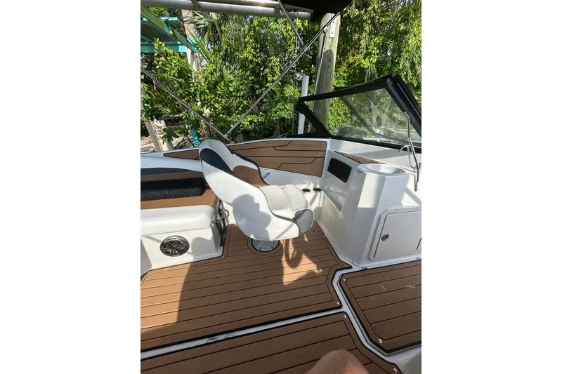 Slide: The Image of 2023 Starcraft SVX 191 OB boat interior with seating and wood-style flooring. - 26