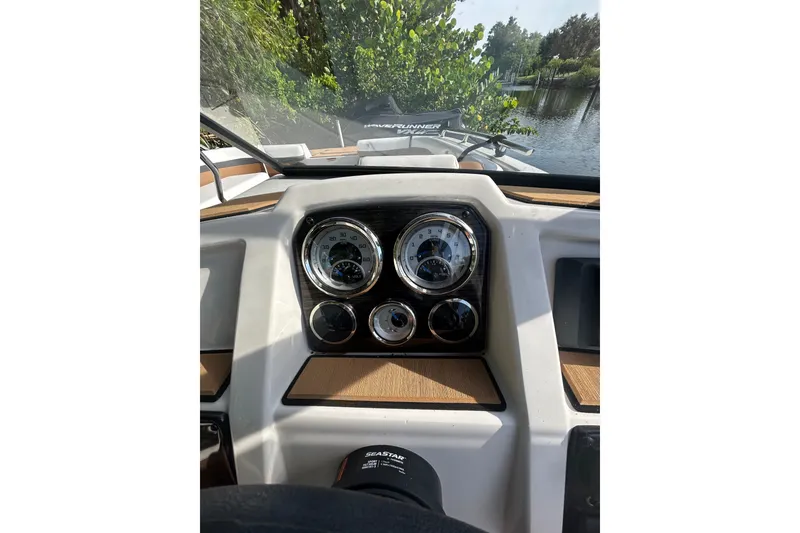 Slide: The Image of Dashboard view of 2023 Starcraft SVX 191 OB boat with gauges and steering wheel. - 14