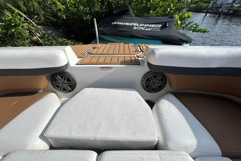 Slide: The Image of 2023 Starcraft SVX 191 OB boat interior with cushioned seating and speakers. - 8