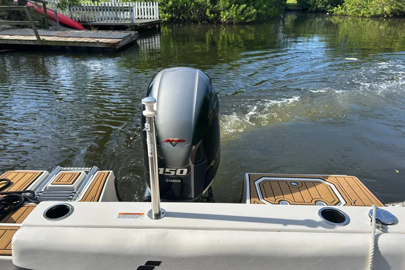 Slide: The Image of 2023 Starcraft SVX 191 OB boat with Yamaha 150 engine on calm water. - 20