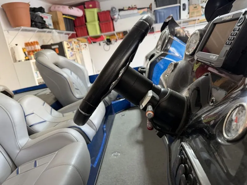 Slide: The Image of The image shows the cockpit of a 2018 Nitro Z18 boat with gray seats and a black steering wheel. - 6