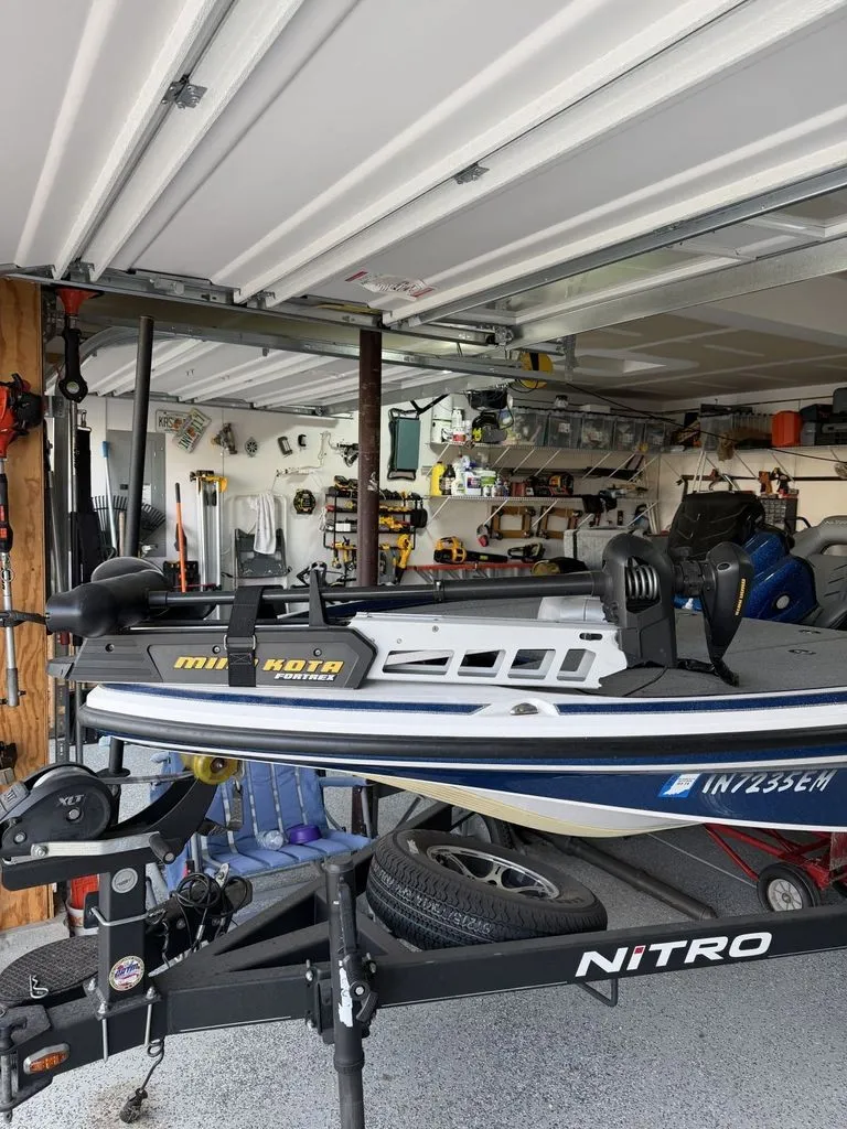 Slide: The Image of A 2018 Nitro Z18 boat stored on a trailer in a garage. - 22