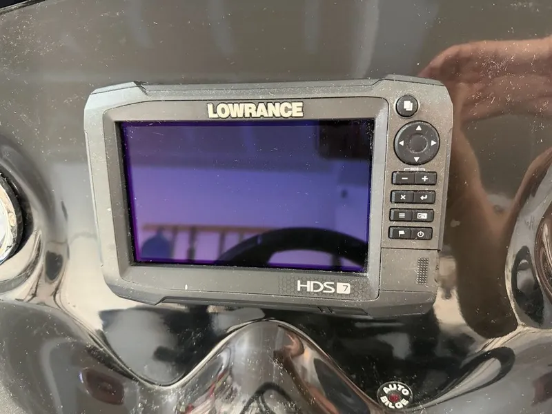Slide: The Image of A Lowrance HDS-7 fishfinder is mounted on a black dashboard. - 10