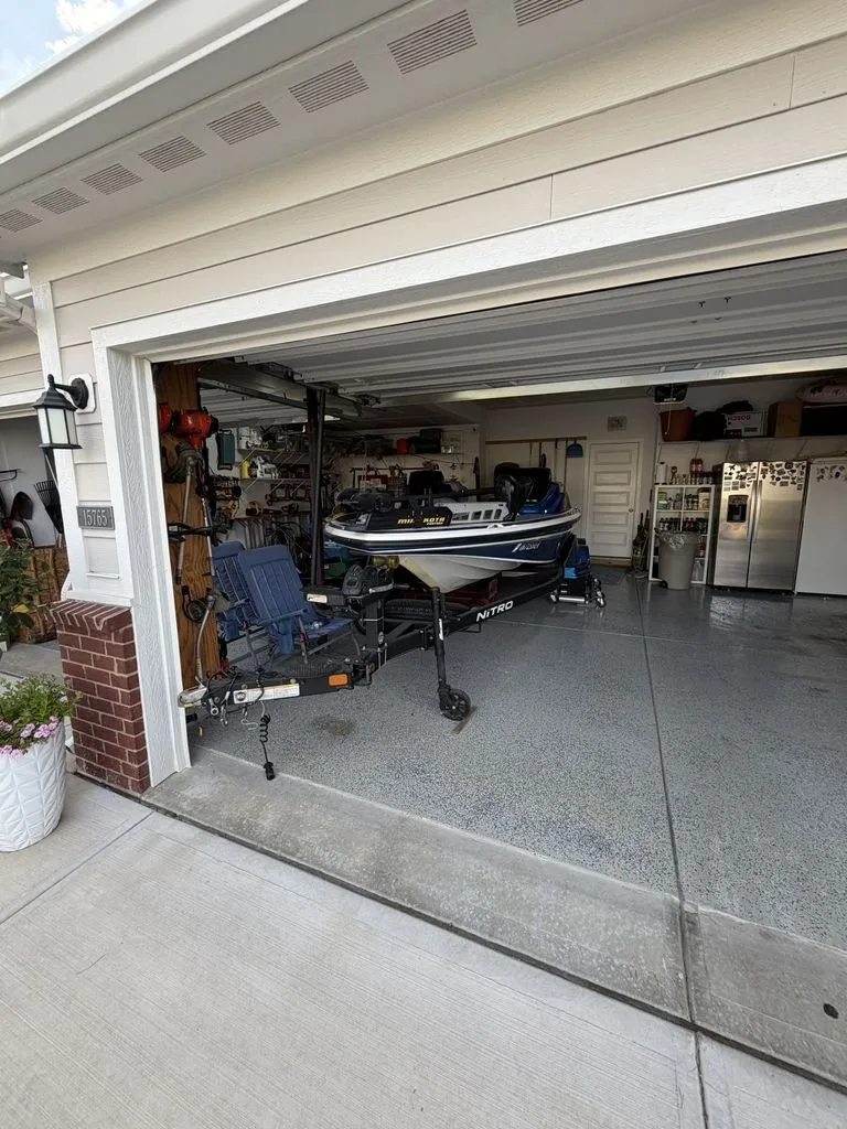 Slide: The Image of A 2018 Nitro Z18 boat is parked in a garage. It is mounted on a trailer. - 19