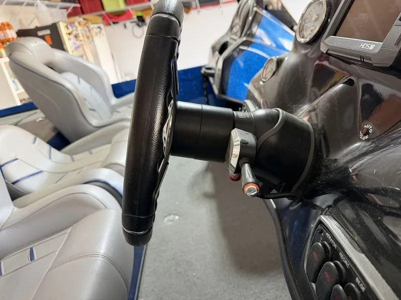 Slide: The Image of Steering wheel and seats of a 2018 Nitro Z18 boat. - 5