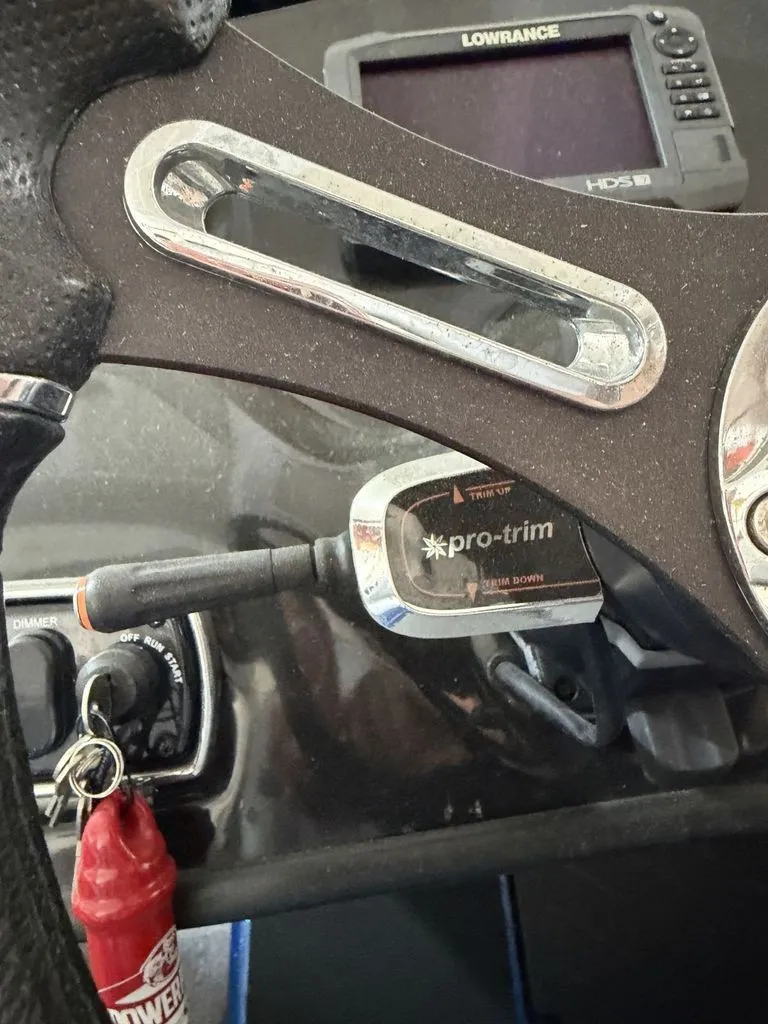 Slide: The Image of Close-up of the helm area of a 2018 Nitro Z18 boat with trim switch and Lowrance device. - 12
