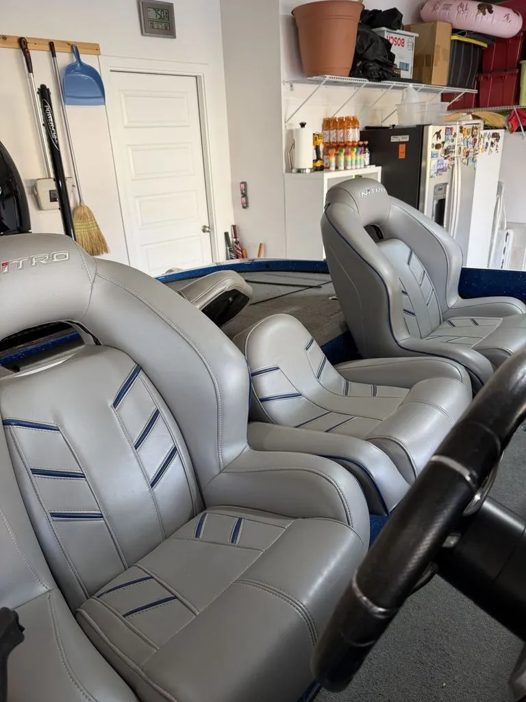 Slide: The Image of The image shows the interior of a 2018 Nitro Z18 boat with gray leather seats. - 13
