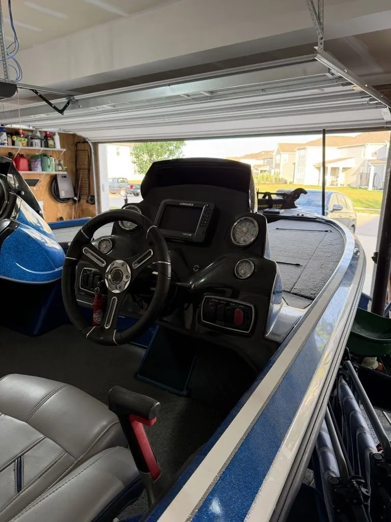 Slide: The Image of The image shows the cockpit of a 2018 Nitro Z18 boat in a garage. - 4