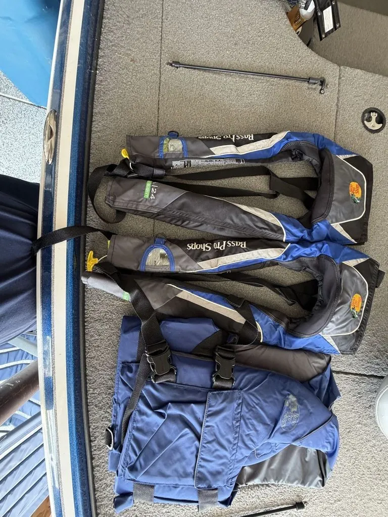 Slide: The Image of Two blue life jackets are lying on the floor of a boat. - 18