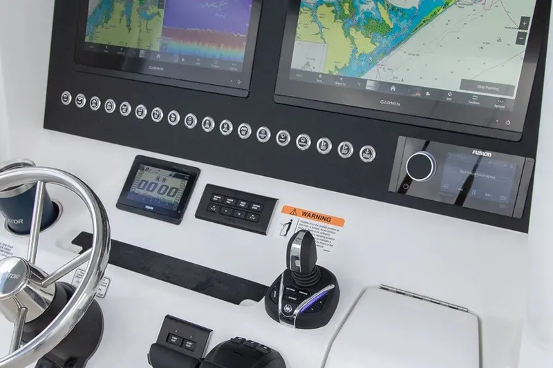 Slide: The Image of Control panel of 2027 Regulator 28 Forward Seating boat with navigation screens. - 3