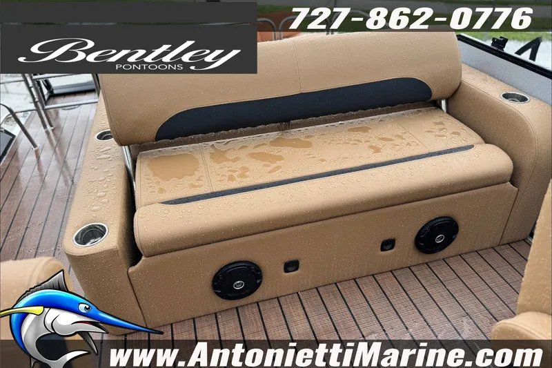 Slide: The Image of 2027 Bentley Pontoons Legacy 223 Swingback with wet tan seating and cup holders on deck. - 5
