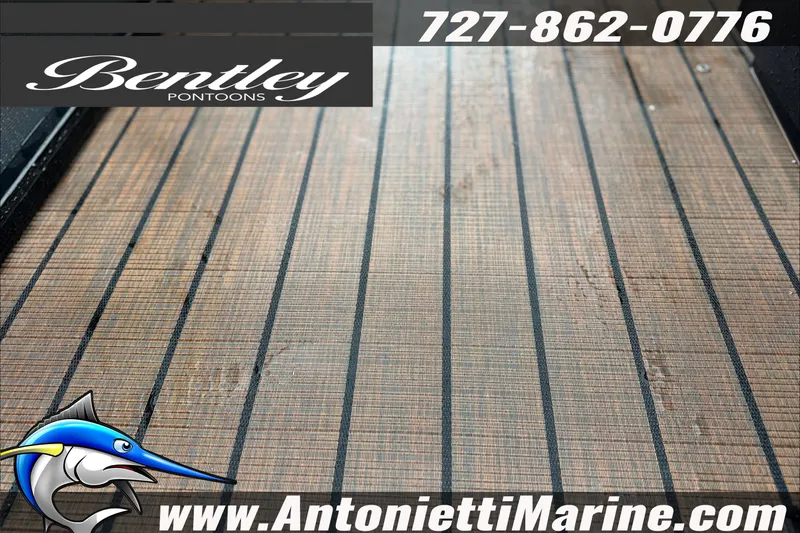 Slide: The Image of Bentley Pontoons Legacy 223 Swingback 2027, featuring sleek deck design and contact information. - 6