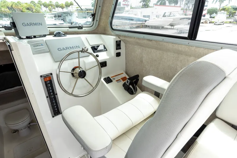 Slide: The Image of Interior of 2022 Parker 2600 Center Console boat with Garmin navigation system. - 4