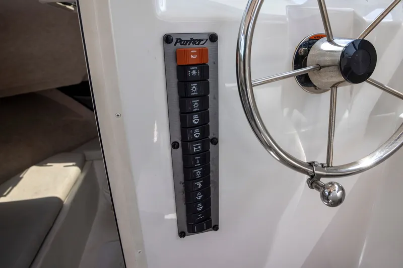 Slide: The Image of Control panel and steering wheel of 2022 Parker 2600 Center Console boat. - 15