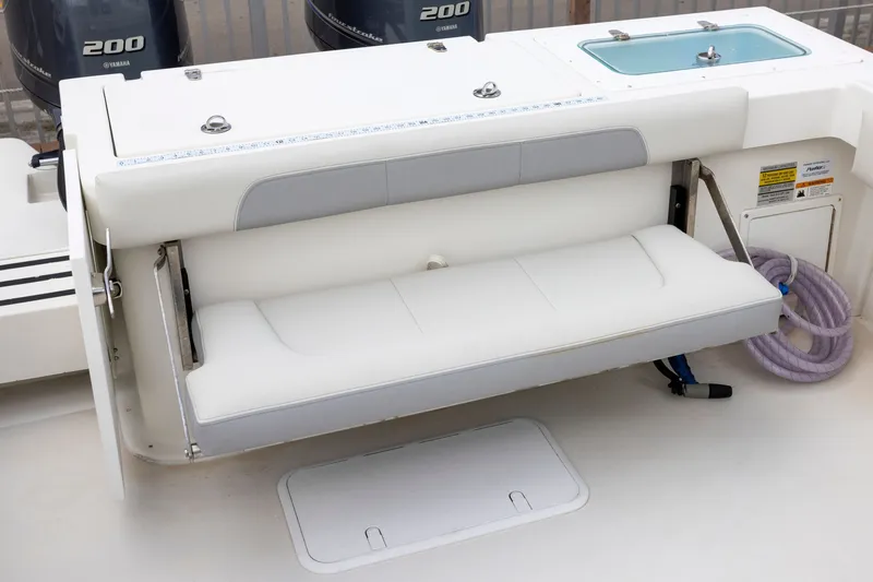 Slide: The Image of 2022 Parker 2600 Center Console boat with foldable seating and Yamaha engines. - 11