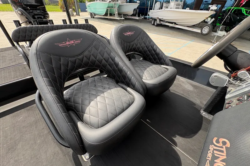 Slide: The Image of Luxurious black leather seats in a 2016 SCB 247 boat, featuring diamond stitching. - 14