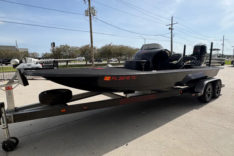Slide: The Image of 2016 SCB 247 boat on Simmons trailer, parked outdoors, with Florida registration. - 8